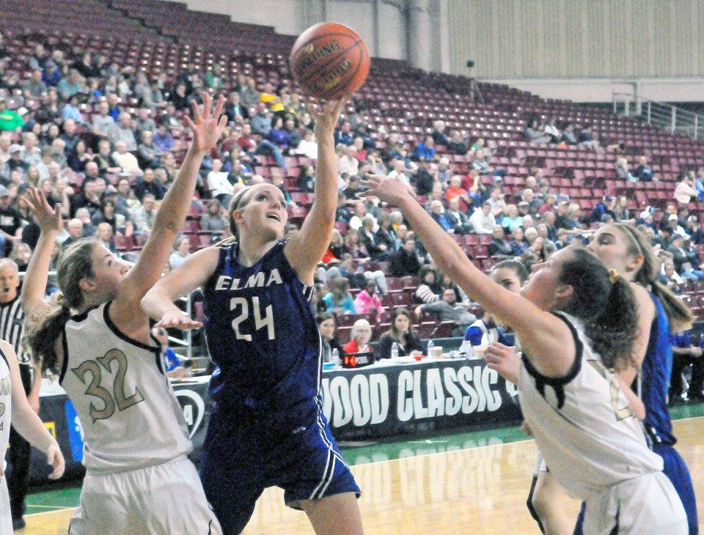 Elmas Molly Johnston splits the defense to hit a layup in the fourth quarter against Meridian in a 1A State Tournament consolation game on Friday. (Hasani Grayson | Grays Harbor News Group)