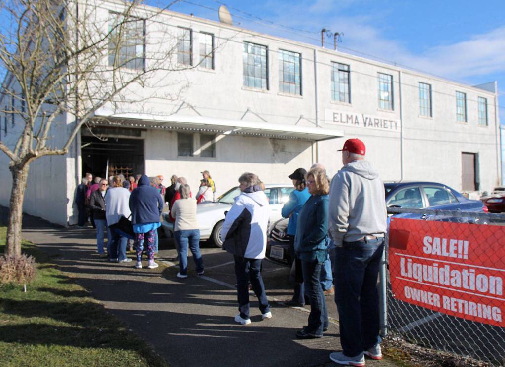 (Michael Lang | Grays Harbor News Group) Customers line up before opening time last Friday at the Elma Variety Store to take advantage of the liquidation sale.
