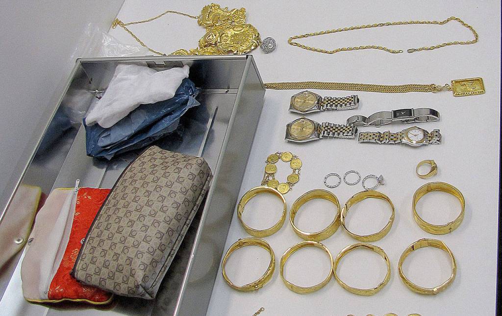 COURTESY GRAYS HARBOR DRUG TASK FORCE                                 Gold, jade and diamond jewelry and high-end watches including Rolexes were among the personal property seized during the Green Jade illegal marijuana growing operations busts in late 2017.
