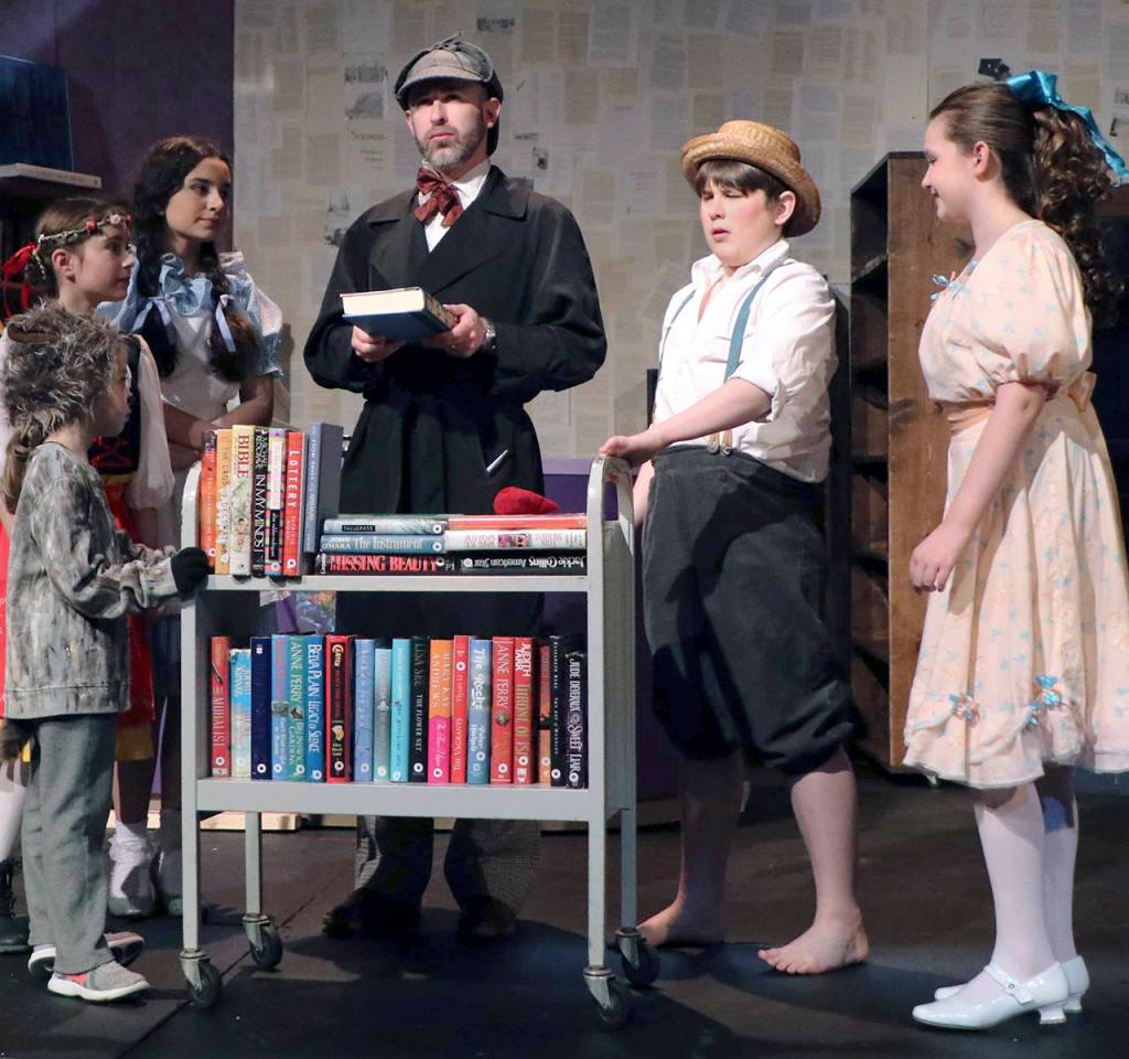 (Photo by Keith J. Krueger) Sherlock Holmes (played by Adam Turpin), center, speaks with other characters, from left: Toto (Aubriel Muñoz), Heidi (Emily Mefford), Dorothy (Alena Membreño), Tom Sawyer (Michael Turpin) and Pollyanna (Madi Valentine).