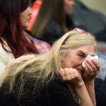 Beth Hynek reacts as family members talks about Julie Knetchel, an Everett mother who was shot to death while trying to protect her son from armed intruders. (Andy Bronson / The Herald)
