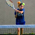 Aberdeens Kylie Knodel hits a back and shot in first set of a match against Teninos Thiresa Sath on Friday. (Hasani Grayson | Grays Harbor News Group)