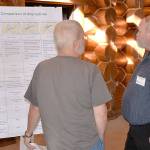 DAN HAMMOCK | GRAYS HARBOR NEWS GROUP                                Dennis Engel with the Department of Transportation, right, discusses the four options for the replacement of the Heron Street Bridge with one of the 150 people who attended the open house Wednesday at the Rotary Log Pavilion.