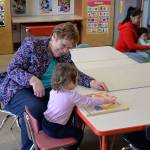 (Louis Krauss | Grays Harbor News Group)                                Gayle Capsel, director of Snug Harbor, plays with a child at the daycare Friday.