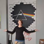 DAN HAMMOCK | GRAYS HARBOR NEWS GROUP Local artist Nina Yates with some of her works on display at the RocknBrews restaurant in Westport, due to open April 1. Behind her is a mural that combines the unmistakable art from Pink Floyds The Wall and Dark Side of the Moon albums. The canvases feature artists with local roots, Kurt Cobain of Nirvana and Leroy Virgil of Hellbound Glory.