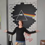 DAN HAMMOCK | GRAYS HARBOR NEWS GROUP Local artist Nina Yates with some of her works on display at the RocknBrews restaurant in Westport, due to open April 1. Behind her is a mural that combines the unmistakable art from Pink Floyds The Wall and Dark Side of the Moon albums. The canvases feature artists with local roots, Kurt Cobain of Nirvana and Leroy Virgil of Hellbound Glory.