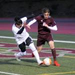 Montesano defender Tucker Stecher jostles for possession with Elmas Rodrigo Luna during Mondays game in Montesano. (Ryan Sparks | Grays Harbor News Group)