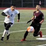 Montesanos Luis Muro, right, races to the ball against Elmas Rene Duran during Mondays game at Jack Rottle Field. Monte earned a 1-0 penalty-kick shootout victory. (Ryan Sparks | Grays Harbor News Group)