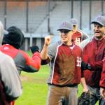 Hoquiams Jackson Folkers celebrates with teammates and coaches after picking up the final out of the game. (Hasani Grayson | Grays Harbor News Group)
