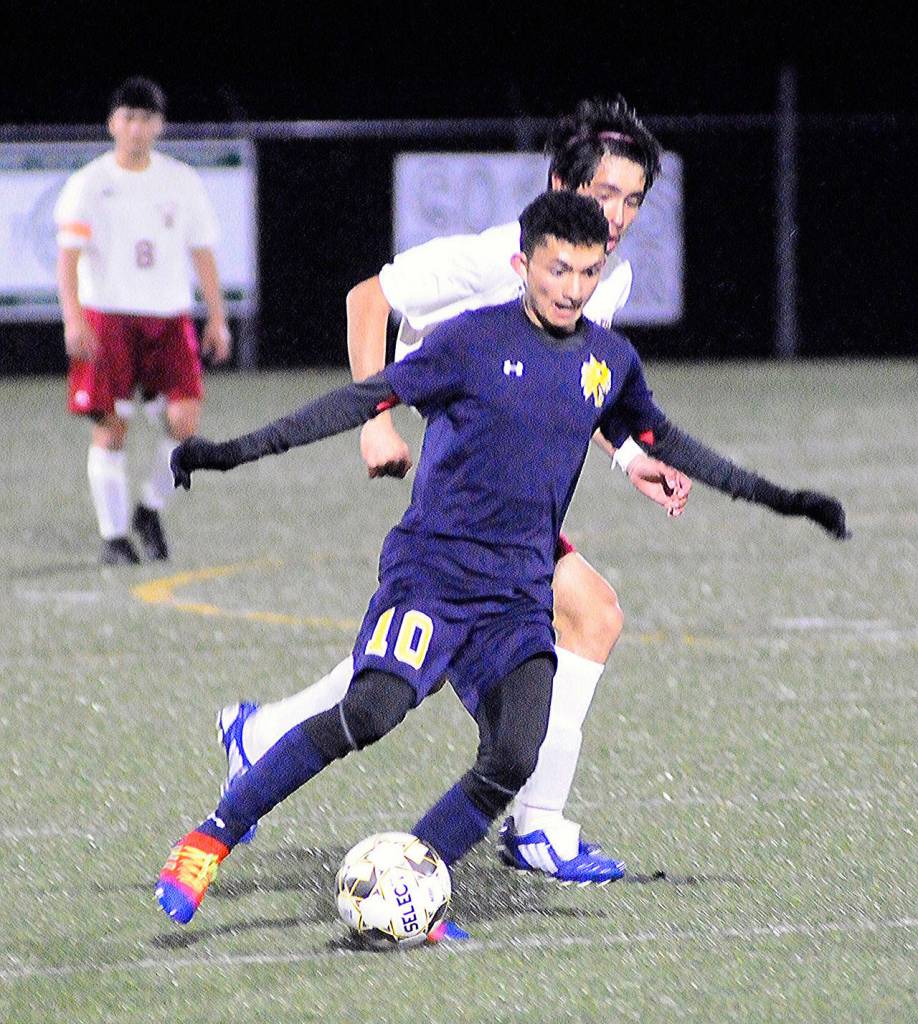 Aberdeens Antonio Torres dribbles past a defender near the top of the box in the second half against WF West. Torres scored the only goal in Aberdeens 1-0 win over the Bearcats (Hasani Grayson | Grays Harbor News Group)