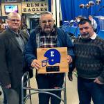 Former Elma High School public address announcer Jack Prince, middle, is flanked by his son, Scott Prince, right, and former Elma Athletic Director Steve Bridge during the Elma High School football banquet in 2018. Jack Prince passed away on March 26. (Submitted photo)