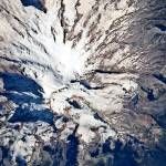 (NASA) With the ending of the last Ice Age, as the continental and alpine glaciers melted, the ocean levels rose to our current sea level. Pictured are the glaciers remaining on Mt. Rainier.