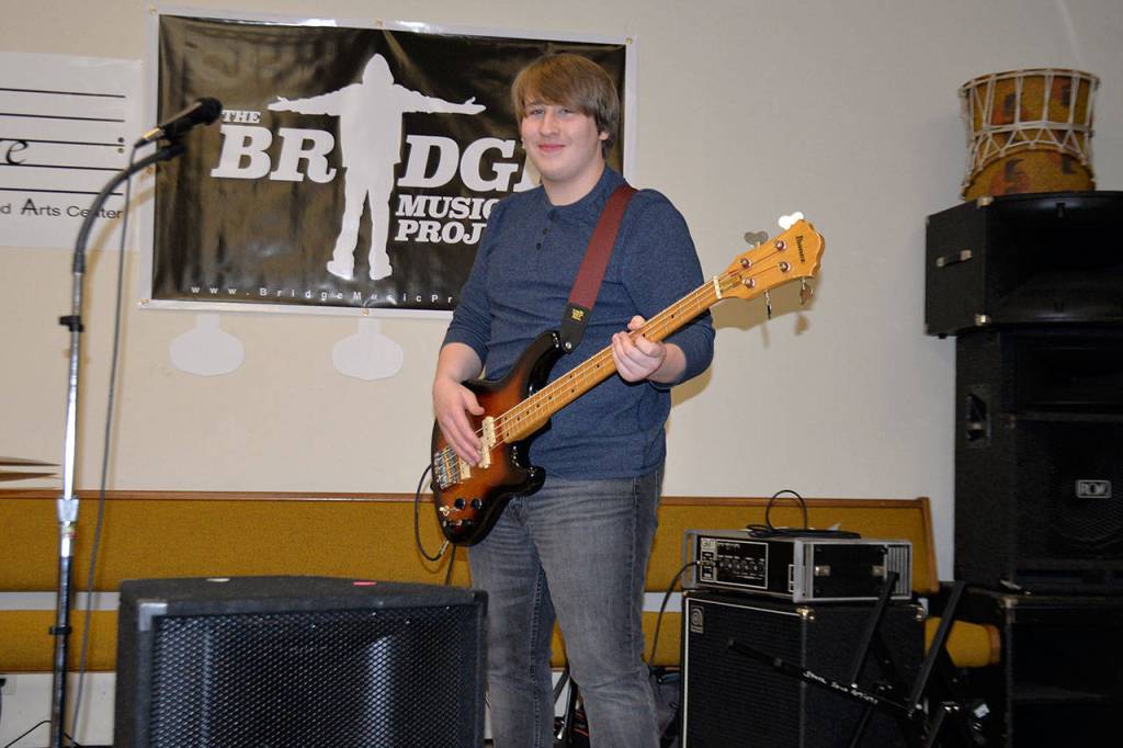 (Louis Krauss | Grays Harbor News Group) Gabe Turpin plays the bass at a rehearsal for the Bridge Music Project last week.