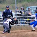 Elmas Kali Rambo slides home and avoids the tag from Hoquiams Emiley Elders in the seventh inning on Tuesday. (Hasani Grayson | Grays Harbor News Group)