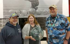 COURTESY WESTPORT SOUTH BEACH HISTORICAL SOCIETY                                A drawing for a premium 16-inch Japanese glass fishing float like this one will be held Saturday at noon during the Whale of a Sale at McCausland Hall. Terri Branson-Varga found this float and took it to the Grayland Driftwood Show on March 31 to show to beachcombing experts Alan Rammer, left, and John Anderson.