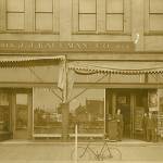 The J.J. Kaufman store located in the Keith Block at 212-214 E. Heron Street, near H Street. The Kaufman storefront would later become the location of Woolworths, and in the 1970s the Spar Arcade before being razed following a fire in May o, 1980. Today it is part of the Arbys property. An interesting detail of the photo, besides the wood plank sidewalk, is the reflection in the window of the site that would become the location of Aberdeens first skyscraper, the five-story Finch Building, in 1910. (Roy Vataja Collection)