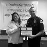 (Courtesy April Heikkila | Grays Harbor News Group) Sarah Oleachea, a member of the Harbor Strong coalition and an Aberdeen High School student parent, presents Aberdeen Police Chief Steve Shumate a certificate of appreciation for efforts to reduce unused prescription medications in Aberdeen.