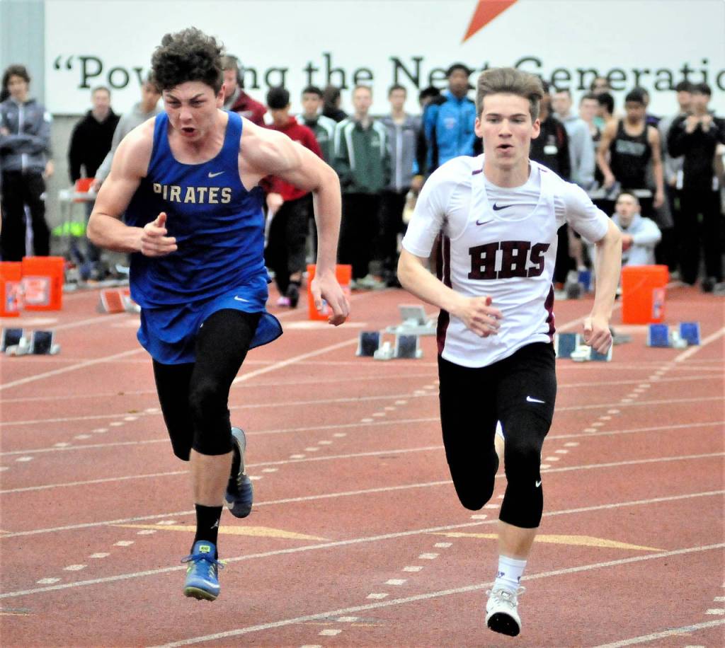 Hoquiams Jack Moodenbaugh, right, picks up speed during the 100-meter dash at the Chehalis Activators meet on Friday. Moodenbaugh advanced to Saturdays finals with a time of 12.02. (Hasani Grayson | Grays Harbor News Group)