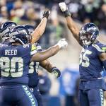 Seattle Seahawks defensive end Frank Clark celebrates his sack on Philadelphia Eagles quarterback Carson Wentz with a raised fist in the first half on Sunday, Dec. 3, 2017. Clark was traded to the Kansas City Chiefs on Tuesday. (Bettina Hansen/Seattle Times/TNS)