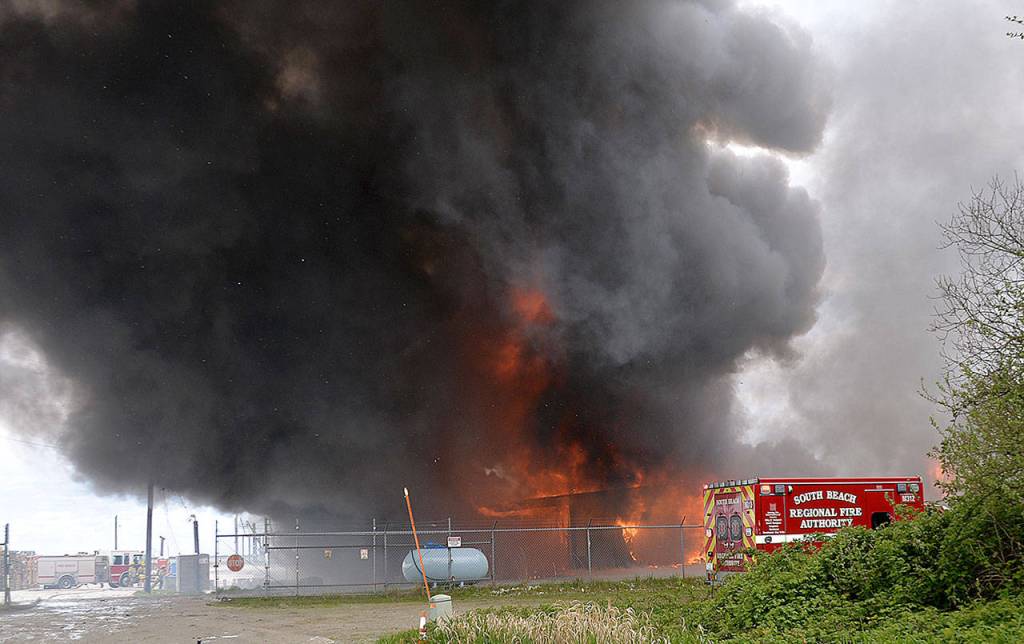 DAN HAMMOCK | GRAYS HARBOR NEWS GROUP                                Crews from the South Beach Regional Fire Authority and Fire District 2 fight a fire at the Coast Seafood processing plant off State Route 105. Thick black smoke drifted over the nearby highway and the Ocean Spray plant just to the east during the Tuesday afternoon blaze.