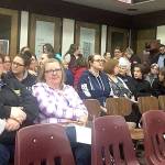 DAN HAMMOCK | GRAYS HARBOR NEWS GROUP Hoquiam School District employees gathered at the Hoquiam High School library prior to Tuesdays special school board meeting. The board later voted 4-1 in favor of a resolution to cut 19 school positions in the face of a $2 million budget deficit in the 2019-20 school year.