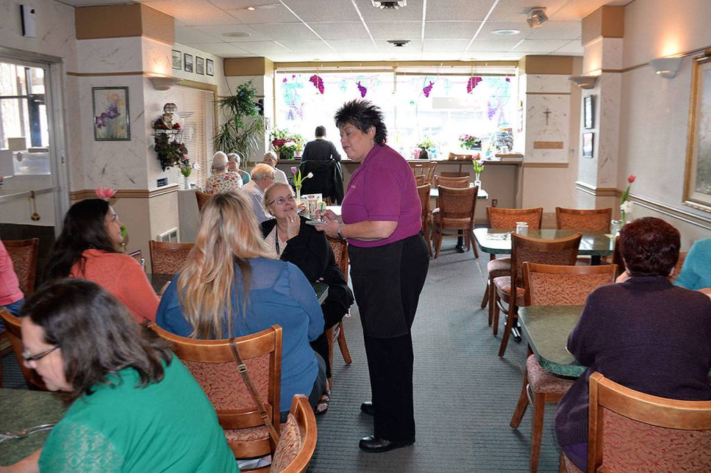 Anne Marie Babineau takes orders at her cafe in Aberdeen on Thursday afternoon.