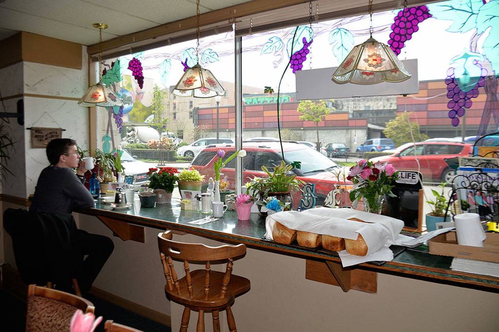 Photos by Louis Krauss | Grays Harbor News Group                                Aberdeen City Engineer Kris Koski sits in Anne Maries Cafe Thursday. On the counter, a fresh-made batch of bread rests under some napkins.