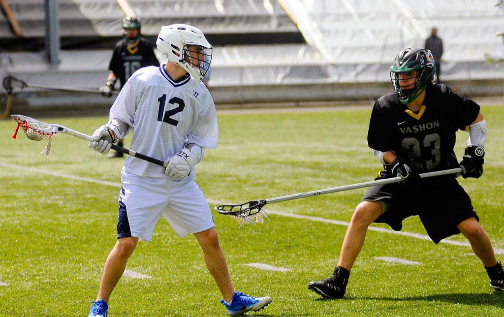 Grays Harbors Martin Shack, right, tries to by by Vashon defender Jacob Magdasy in the second half of a game on Saturday at Stewart Field. (Hasani Grayson | Grays Harbor News Group)