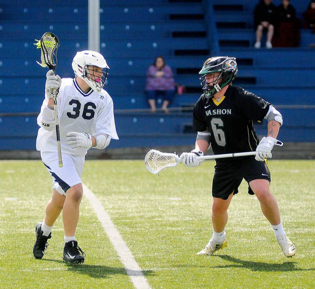 Grays Harbors Steve Rademoacher, right, tries to bring the ball up field while defended by Paris Brown from Vashon on Saturday at Stewart Field. (Hasani Grayson | Grays Harbor News Group)