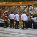 Emergency crews investigate the scene of a collapsed crane at Fairview Avenue North and Mercer Street in Seattles South Lake Union neighborhood on Saturday. (Alan Berner/Seattle Times)