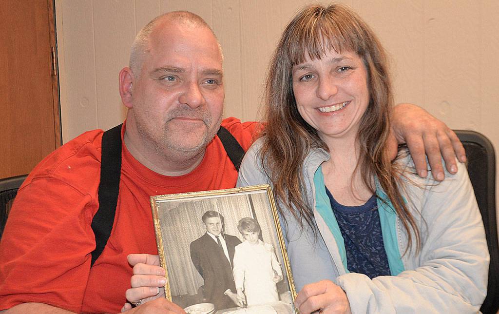DAN HAMMOCK | GRAYS HARBOR NEWS GROUP                                Tom Flink and his wife, Wendy, with a wedding photo of Toms parents, John and Laura Flink. Laura Flink disappeared some time after leaving Aberdeen on a drive to Moclips 50 years ago.