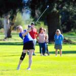 Elmas Corrie Shedd takes her approach shot from fairway on the fourth hole in a match against Montesano. Shedd was tied for the team lead with a score of 56 on Tuesday. (Hasani Grayson | Grays Harbor News | Group)