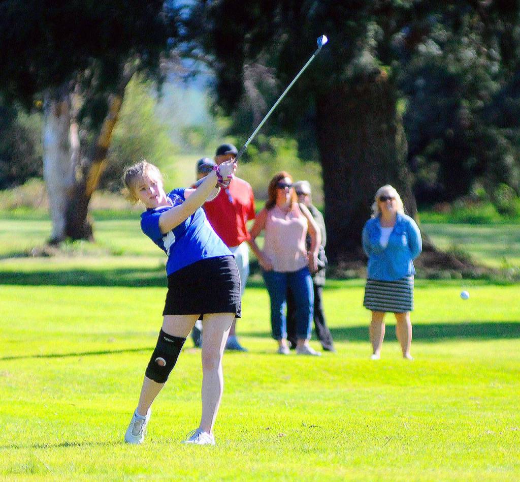 Elmas Corrie Shedd takes her approach shot from fairway on the fourth hole in a match against Montesano. Shedd was tied for the team lead with a score of 56 on Tuesday. (Hasani Grayson | Grays Harbor News | Group)