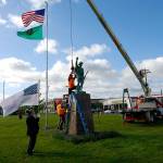 Courtesy Thorin Sprandel                                Construction workers use a crane to reinstall the Doughboy statue at Zelasko Park in Aberdeen Wednesday morning after it was repaired.