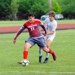 Hoquiams Andy Garcia dribbles past Ilwacos Jaden Turner in the first half on Thursday. (Hasani Grayson | Grays Harbor News Group)