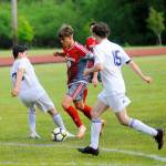 Hoquiams Hector De La Osa splits a pair of Ilwaco defenders and scores a goal in he first half against Ilwaco on Thursday. (Hasani Grayson | Grays Harbor News Group)
