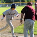 Montesanos Parker Plato high fives head coach Mike Osgood after hitting a home run in the sixth inning against Hoquiam on Friday. Plato had four RBI in Montes 6-2 win over Hoquiam. (Hasani Grayson | Grays Harbor News Group)