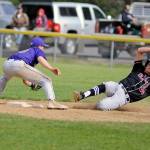 Ocostas Cole Hatton, right, is tagged out at second base after trying to advance on a pop out in a 2B District IV playoff game against Onalaska on Saturday. (Ryan Sparks | Grays Harbor News Group)