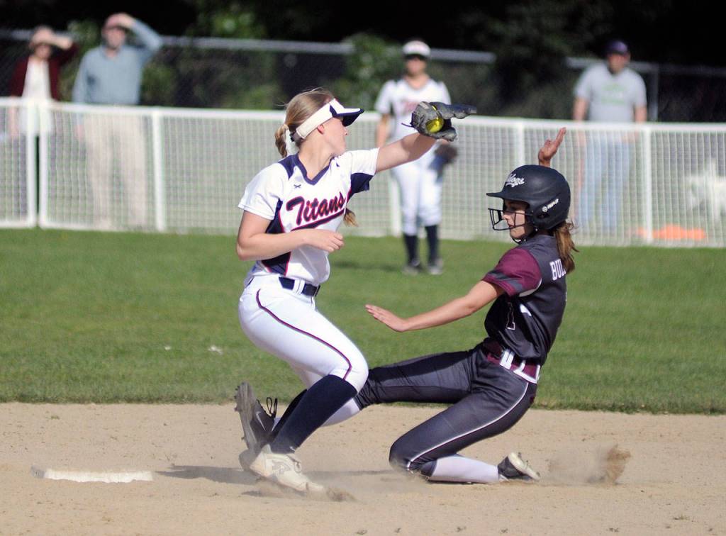 Montesanos Landree Dohrmann, right, slides into second base ahead of the tag of PWV shortstop Katie Adkins during Montes 13-12 victory on Monday at Montesano High School. (Ryan Sparks | Grays Harbor News Group)