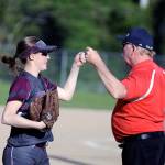 In an example of good sportsmanship, Montesano left fielder Matti Ekerson, left, gets a fist bump from PWV head coach Ken Olson after Ekerson made a leaping catch on a lined shot by Katelyn McGough in the sixth inning of Mondays game. Ekersons play prevented the tying and go-ahead runs from scoring. (Ryan Sparks | Grays Harbor News Group)