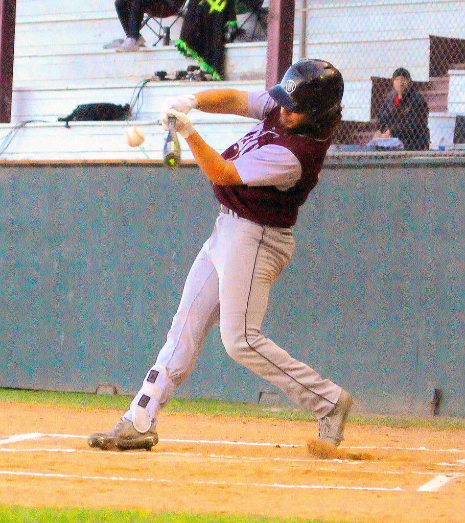 Montesanos Teegan Zillyet hits a double into the left centerfield gap against La Center on Monday at Olympic Stadium. (Hasani Grayson | Grays Harbor Newsgroup)