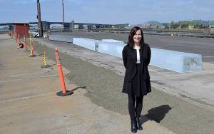 DAN HAMMOCK | GRAYS HARBOR NEWS GROUP                                Grays Harbor Historical Seaport Executive Director Brandi Bednarik stands on the dock that normally hosts the tall ships Lady Washington and Hawaiian Chieftain. Contractors recently repaired a portion of the dock, which should allow the tall ships to return for the Aberdeen Splash Festival in July.