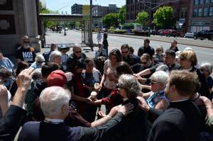 Louis Krauss | Grays Harbor News Group                                 A group of priests and homeless advocates say a prayer with several plaintiffs involved in a lawsuit attempting to stop the City of Aberdeen from clearing the Chehalis River homeless camps.