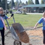 Photo courtesy Comcast Corp.                                Volunteers Mindy Dunn (left) and Brandi Jo Ross spread wood chips May 4 at McClearys Beerbower Park. The women were taking part in Comcast Corp.s Comcast Cares Day.