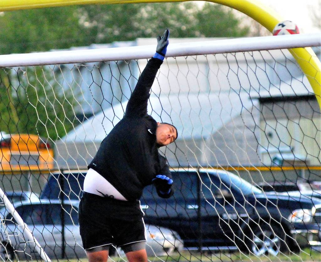 Elma keeper AJ Hernandez pushes a shot over the cross bar in the second half of a match against Toldeo-Winlock United. (Hasani Grayson | Grays Harbor News Group)