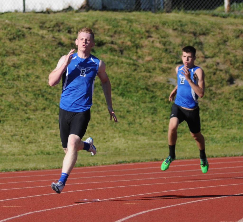Elmas Cody Vollan, left, races around the final corner of the boys 400 meters during the 1A Evergreen League Championship meet in Montesano. Vollan won the event with teammate Ray Billerback, right, placing second. (Ryan Sparks | Grays Harbor News Group)