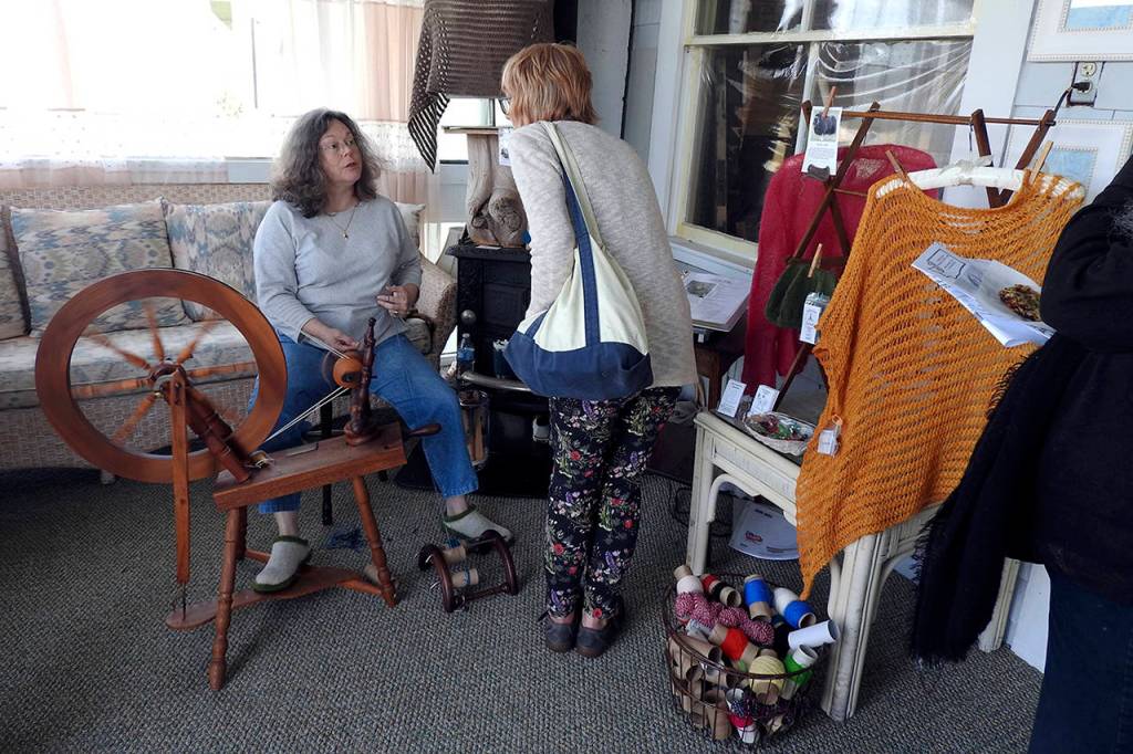 Photos by Kat Bryant | Grays Harbor News Group                                Robin Spady chats with a Studio Tour visitor about her weaving technique.