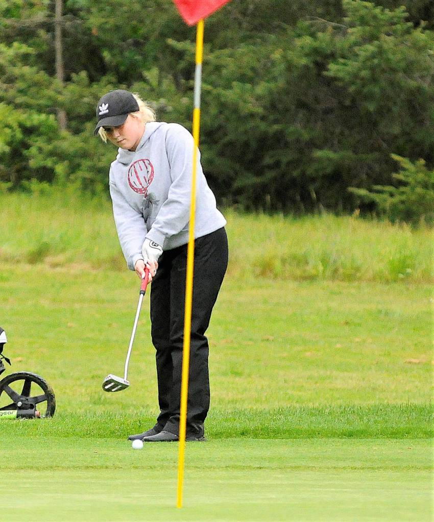 Hoquiams Bailey Smith putts from the edge of the rough during the second day of competition of the SWW1A District Golf Tournament on Tuesday in Tumwater. Smith finished fourth in the tournament and qualified for state. (Hasani Grayson |Grays Harbor News Group)