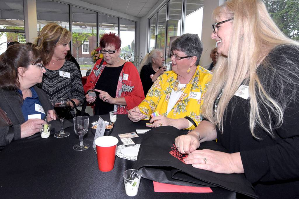 Darrell Westmoreland                                Several stand-up tables were surrounded by women trading stories and information.