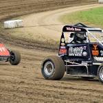 Ray Stebbins (11t) and Nick Evans (24) race their midget cars during the Northwest Focus Midget Series on Saturday at Grays Harbor Raceway. (Photo by AR Racing Videos)
